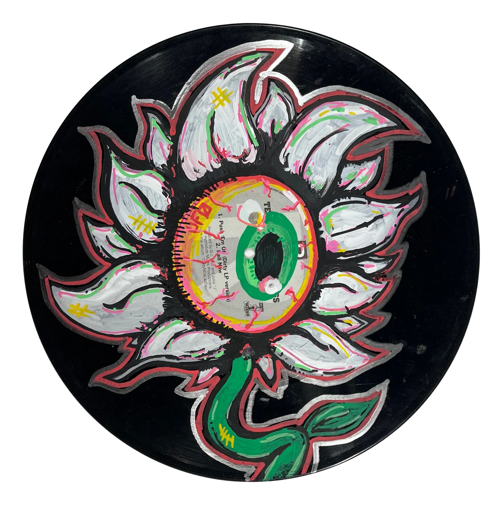 A painting of a white flower. The center of the flower is one bloodshot eyeball with a green iris. It is painted on a black vinyl record